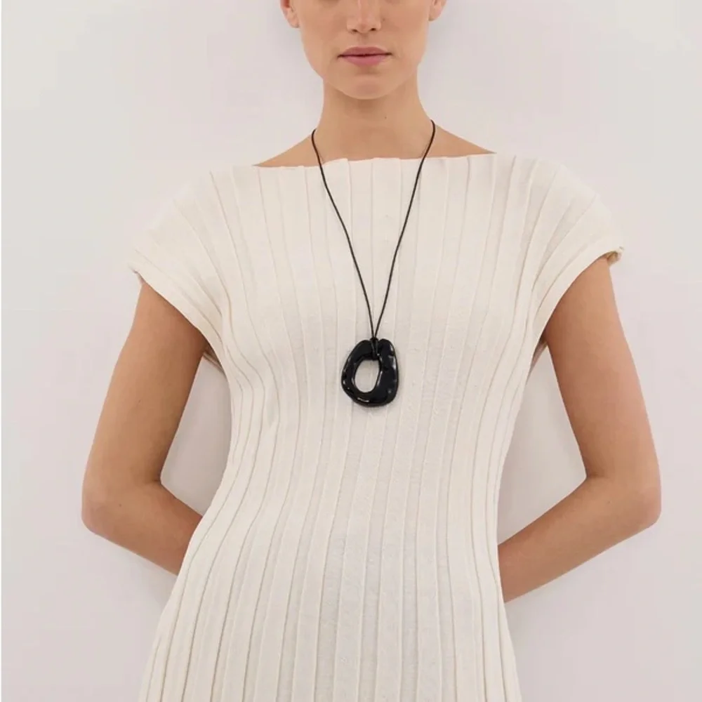 DISSH LOE CREAM SLEEVELESS KNIT TOP - Picture 1 of 6